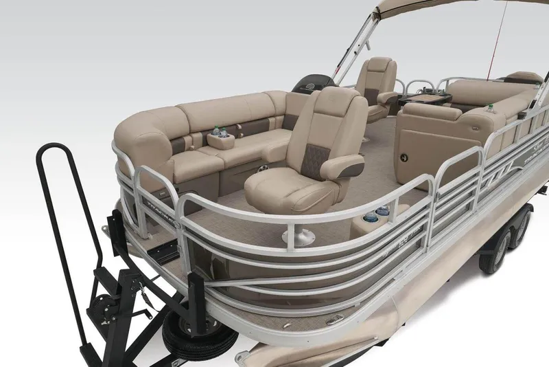 Slide: The Image of 2024 Sun Tracker SportFish 20 DLX pontoon boat with beige seating and railing. - 2