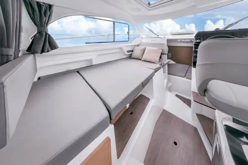 Slide: The Image of Interior of 2024 Beneteau Antares 8 V2 boat, featuring sleek seating and modern design. - 7