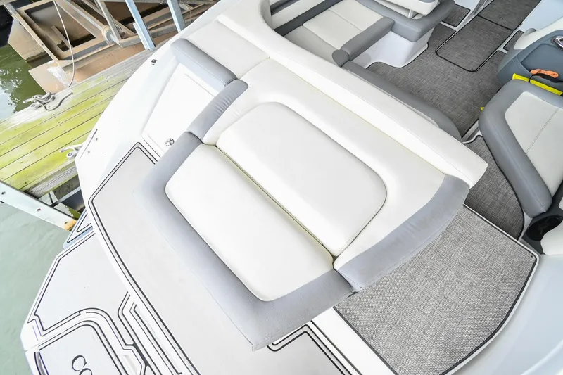 Slide: The Image of 2020 Cobalt CS23 boat interior with cushioned seating and deck area. - 10