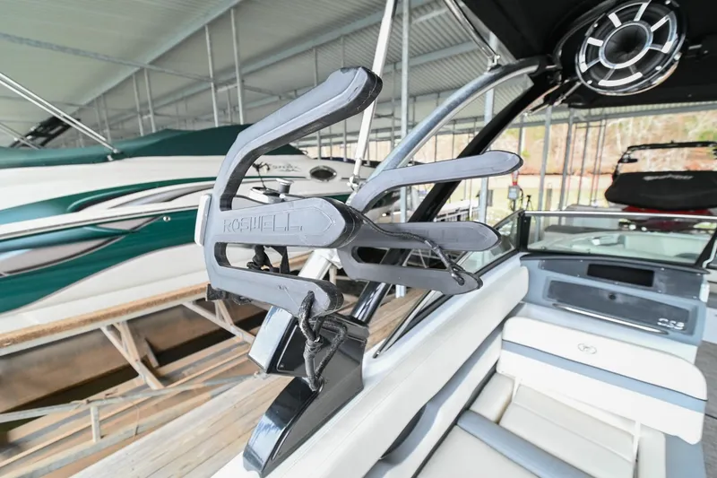 Slide: The Image of 2020 Cobalt CS23 boat interior with wakeboard rack and speaker. - 13