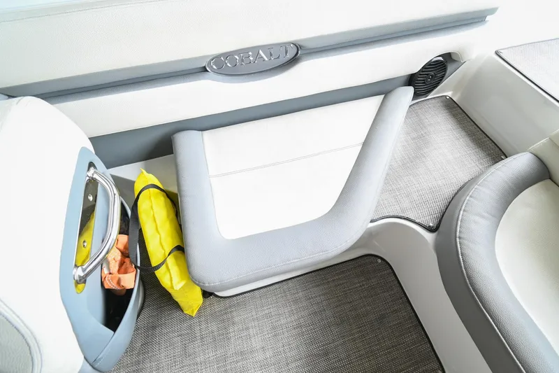 Slide: The Image of 2020 Cobalt CS23 boat interior with seating and storage compartment. - 18