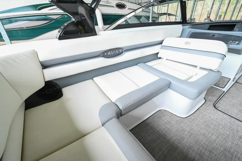 Slide: The Image of 2020 Cobalt CS23 boat interior with white and gray seating. - 22