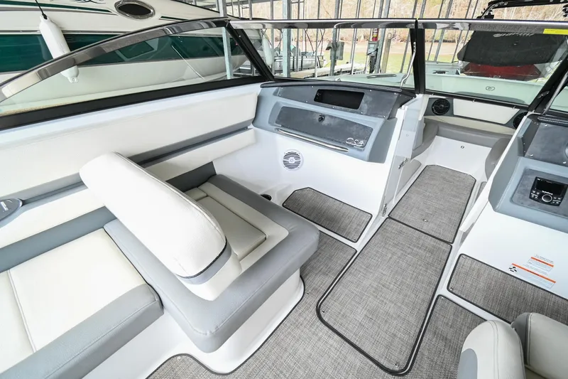 Slide: The Image of Interior of a 2020 Cobalt CS23 boat with modern seating and dashboard. - 25