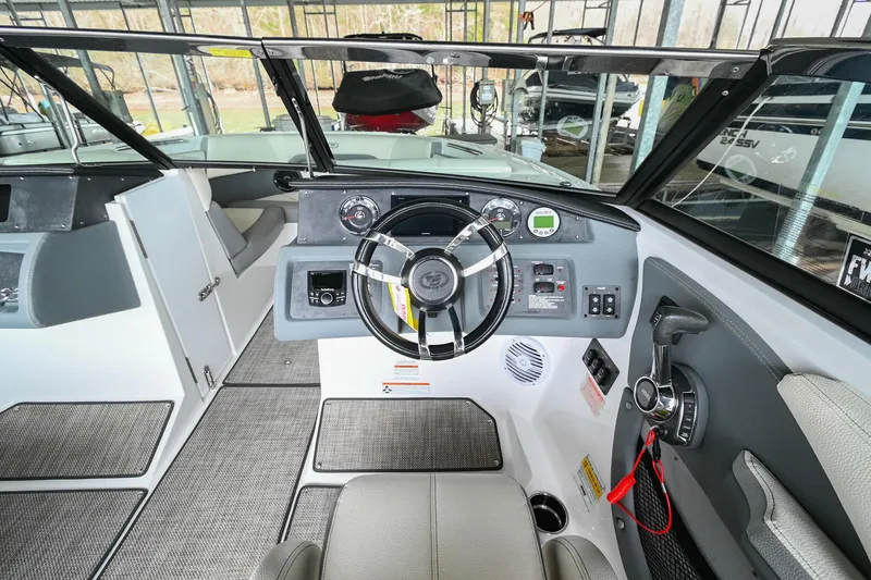 Slide: The Image of 2020 Cobalt CS23 boat cockpit with steering wheel and control panel. - 30