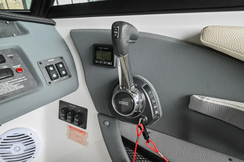Slide: The Image of 2020 Cobalt CS23 boat throttle control and dashboard. - 31
