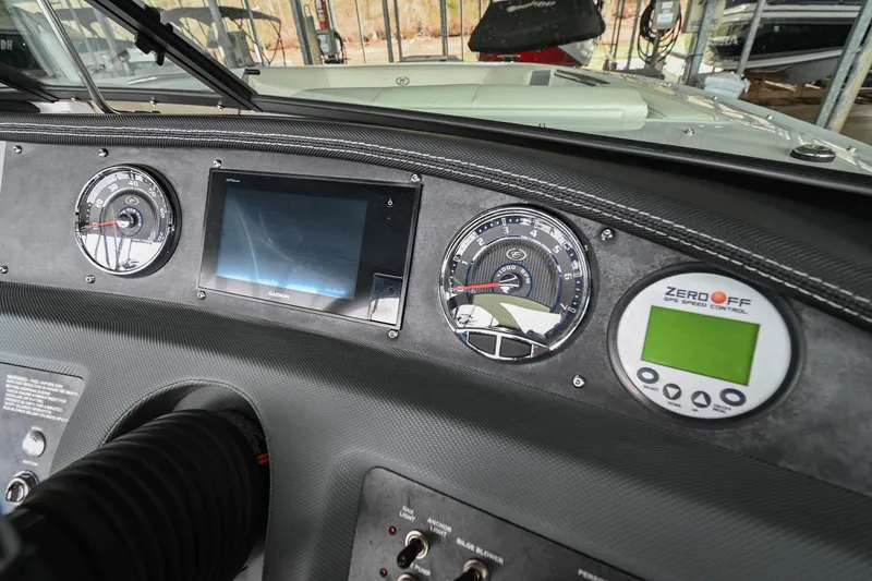 Slide: The Image of Dashboard of a 2020 Cobalt CS23 boat with gauges and digital display. - 33