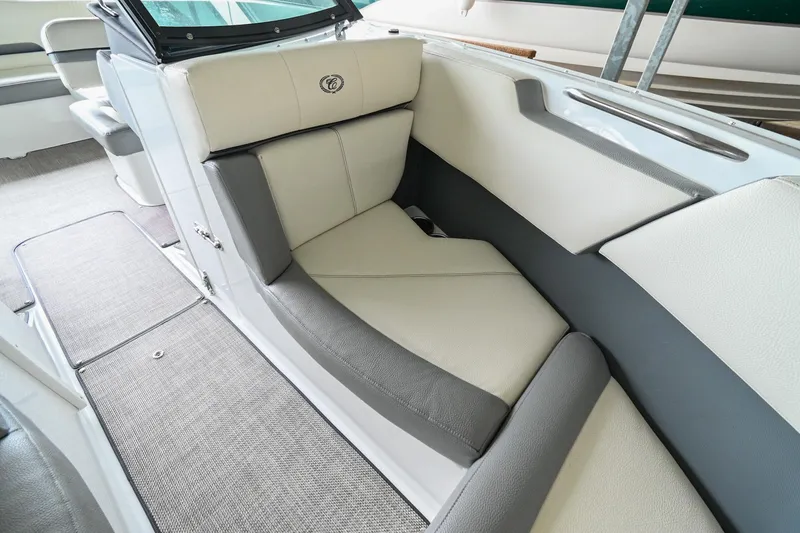 Slide: The Image of 2020 Cobalt CS23 boat interior with beige and gray seating. - 39
