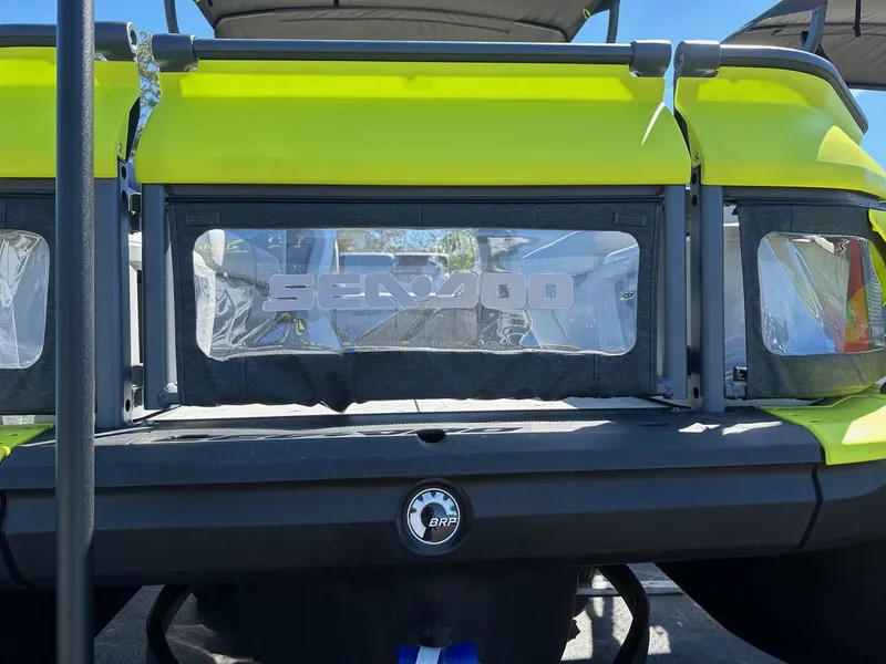 Slide: The Image of 2024 Sea-Doo SWITCH CRUISE 21FT 230HP rear view, yellow and black design. - 21