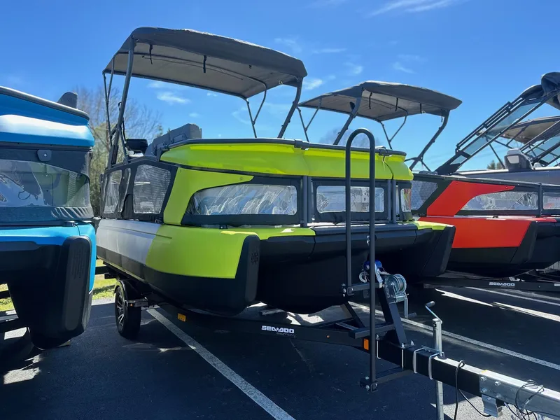 Slide: The Image of 2024 Sea-Doo SWITCH CRUISE 21FT 230HP pontoon boat in bright green on trailer. - 22