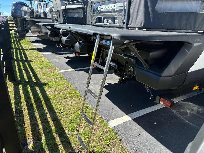 Slide: The Image of 2024 Sea-Doo SWITCH CRUISE 21FT 230HP with ladder, parked in a lot. - 3