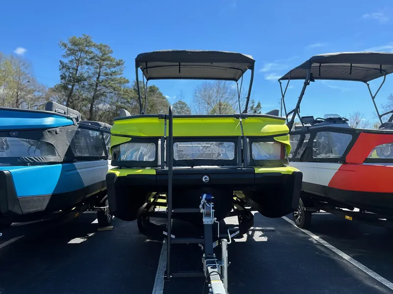 Slide: The Image of 2024 Sea-Doo SWITCH CRUISE 21FT 230HP boats displayed in a parking lot. - 7