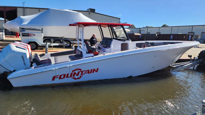 The Image of 2024 Fountain 38 SC boat docked in marina, side view. - 0