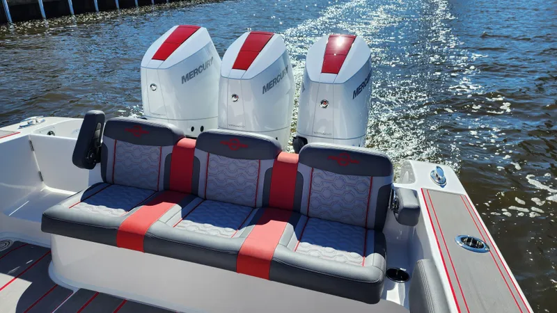 Slide: The Image of 2024 Fountain 38 SC boat with triple Mercury engines on the water. - 11