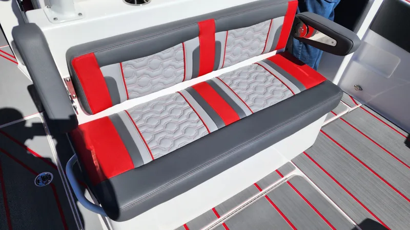 Slide: The Image of 2024 Fountain 38 SC boat with red and gray cushioned seating. - 13