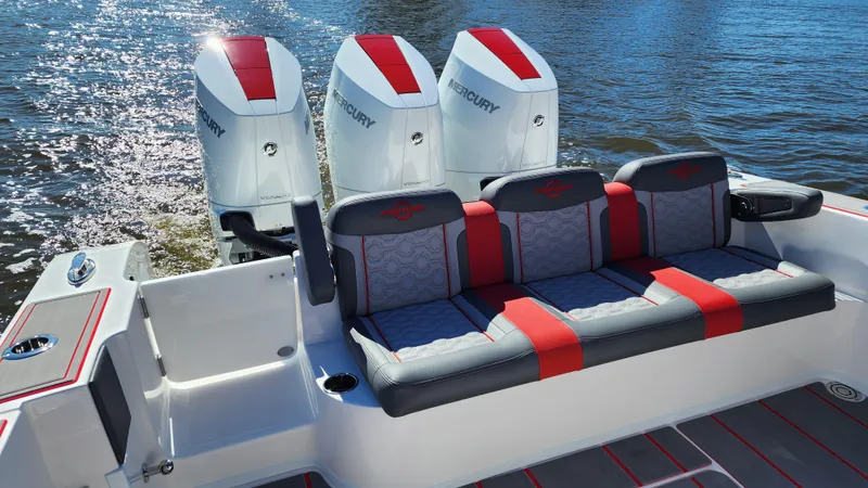 Slide: The Image of 2024 Fountain 38 SC boat with triple Mercury engines and stylish seating. - 14
