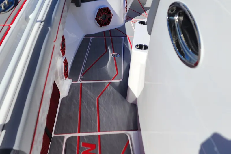 Slide: The Image of 2024 Fountain 38 SC boat interior with red and gray accents. - 18