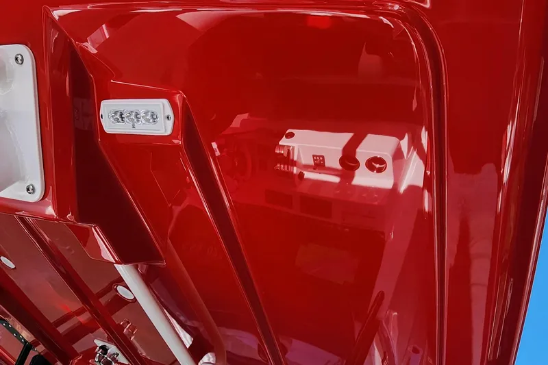 Slide: The Image of 2024 Fountain 38 SC boat with glossy red finish and interior details. - 23