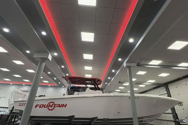 Slide: The Image of 2024 Fountain 38 SC boat displayed indoors with modern lighting. - 24