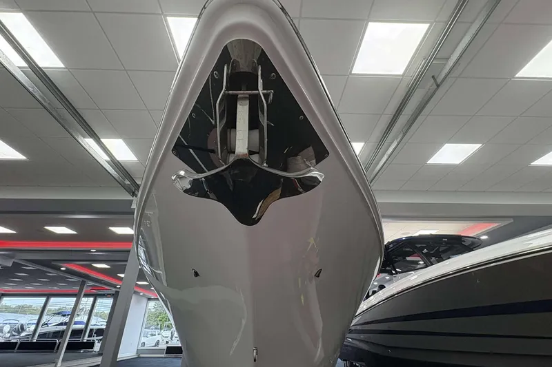 Slide: The Image of 2024 Fountain 38 SC boat displayed indoors, showcasing sleek hull design. - 26