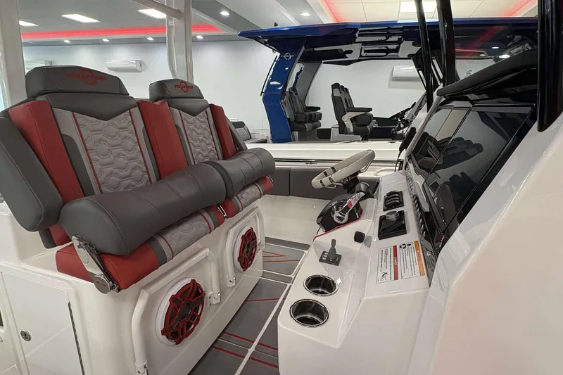 Slide: The Image of 2024 Fountain 38 SC boat interior with luxurious seating and modern dashboard controls. - 35