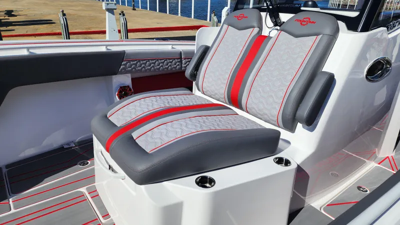 Slide: The Image of 2024 Fountain 38 SC boat seating with red and gray accents. - 4