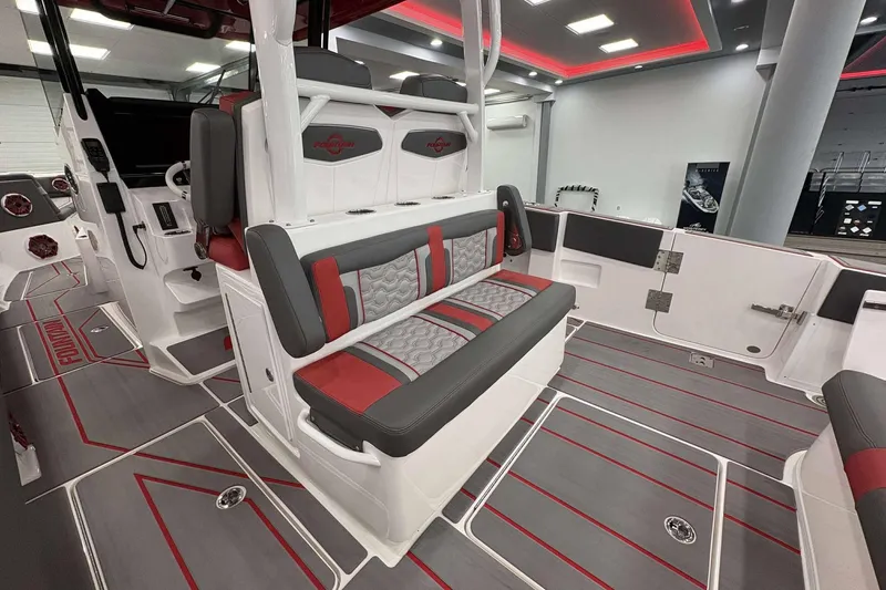 Slide: The Image of 2024 Fountain 38 SC boat interior with red and gray seating and modern design. - 40