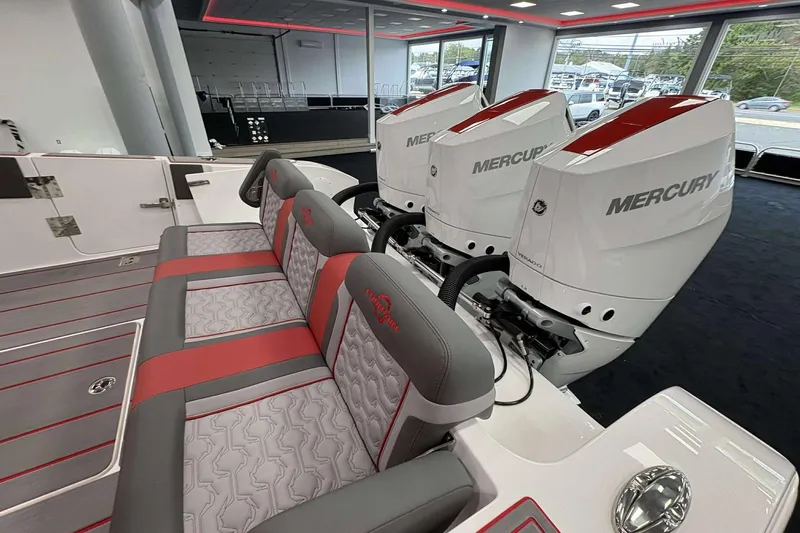 Slide: The Image of 2024 Fountain 38 SC boat with Mercury engines and stylish red-gray seating. - 42