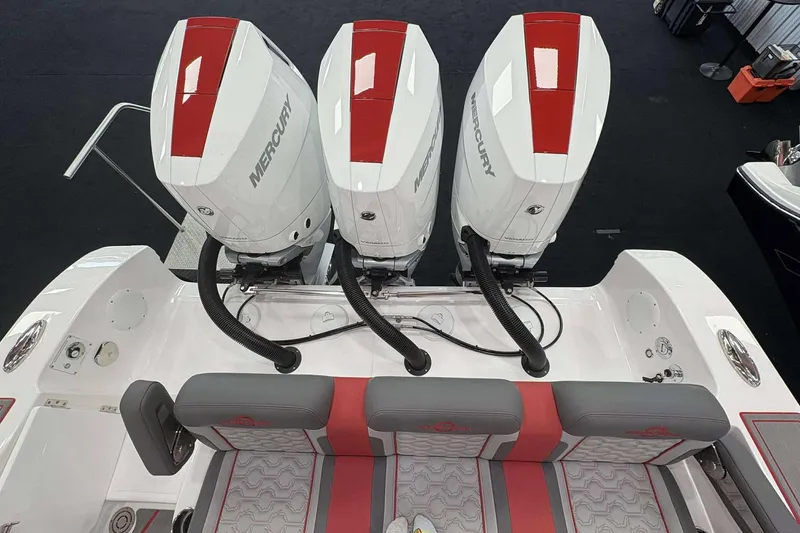 Slide: The Image of 2024 Fountain 38 SC boat with triple Mercury engines, red and gray seating. - 43
