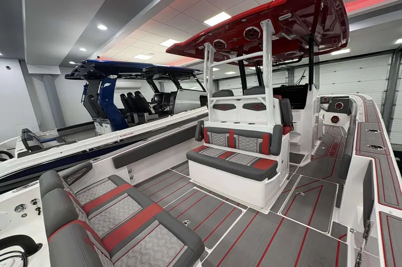 Slide: The Image of 2024 Fountain 38 SC boat interior with red and gray seating, modern design. - 47