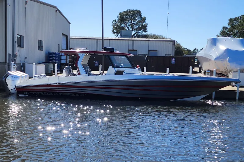 Slide: The Image of 2024 Fountain 38 SCX boat docked at a marina. - 21