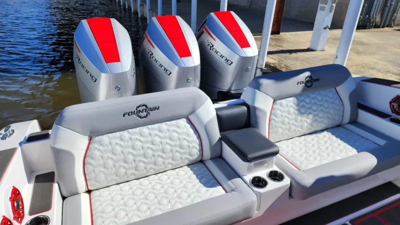 Slide: The Image of 2024 Fountain 38 SCX boat with triple outboard engines and luxurious seating. - 4
