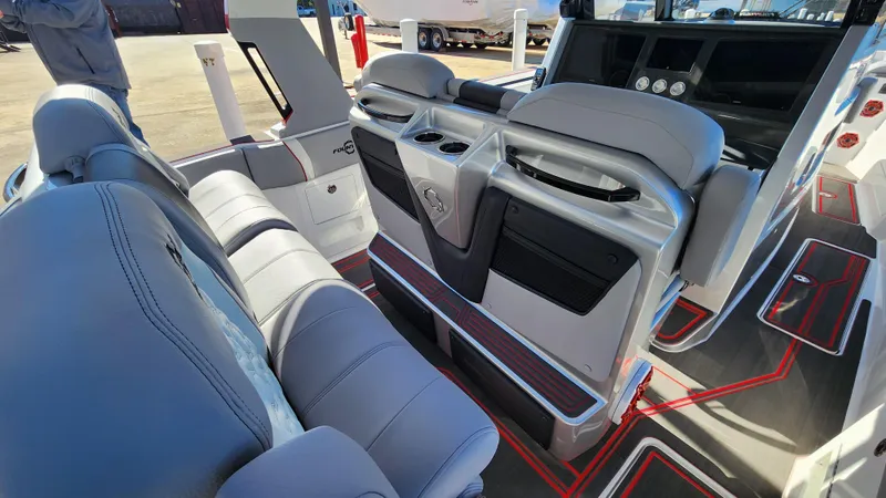 Slide: The Image of 2024 Fountain 38 SCX boat interior with luxurious seating and modern dashboard. - 9