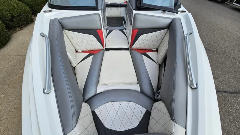 Slide: The Image of 2013 Tigé Z1 boat interior with gray and white seating. - 16