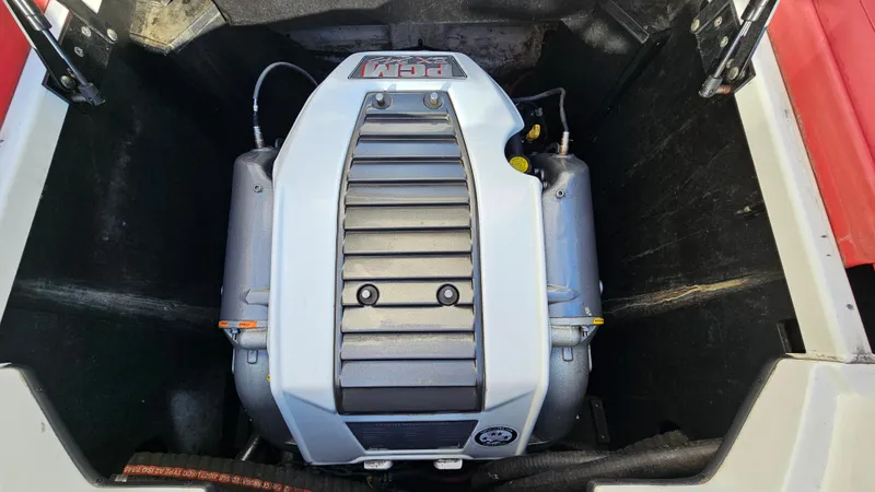 Slide: The Image of 2013 Tigé Z1 boat engine compartment with a powerful inboard motor. - 19