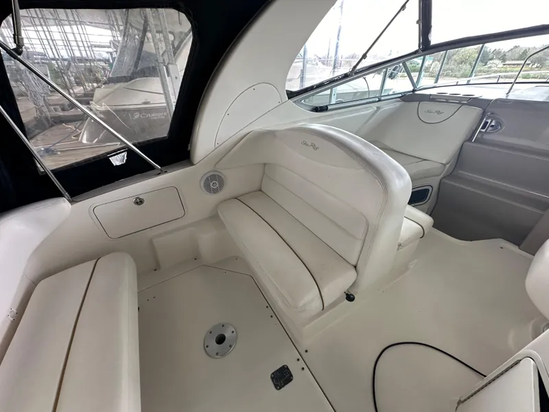Slide: The Image of Interior seating area of a 2003 Sea Ray 280 Sundancer boat. - 12