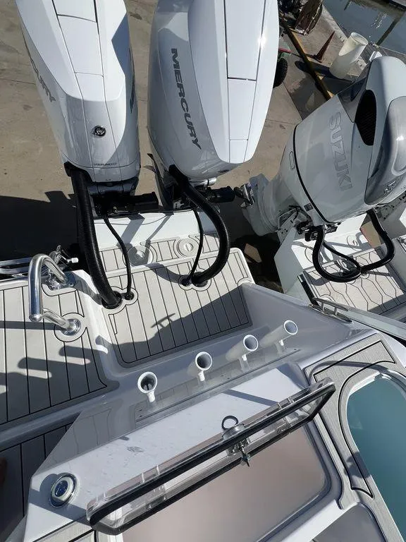 Slide: The Image of 2024 Twin Vee 400 Center Console GFX with dual Mercury outboard engines. - 10