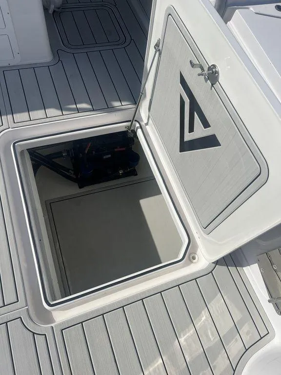 Slide: The Image of 2024 Twin Vee 400 Center Console GFX open hatch on deck. - 14