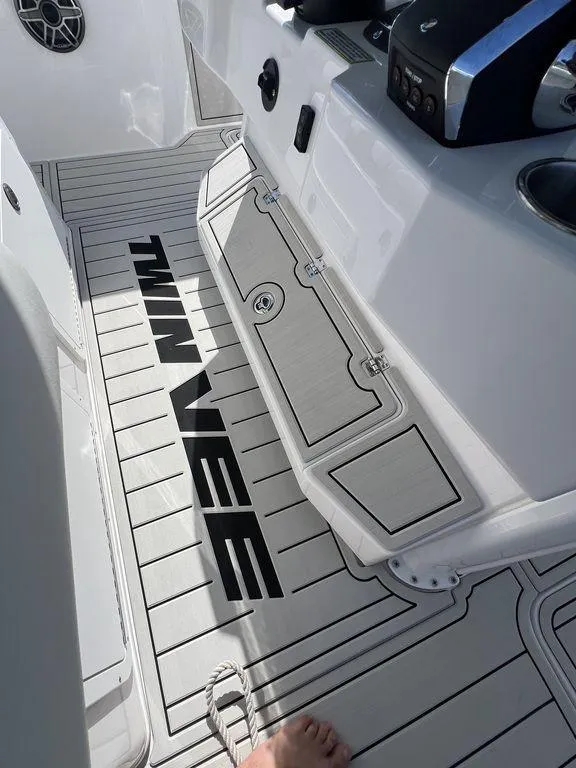 Slide: The Image of 2024 Twin Vee 400 Center Console GFX boat deck with logo. - 27