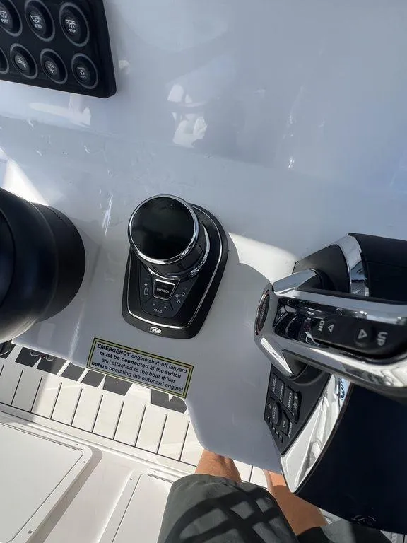 Slide: The Image of 2024 Twin Vee 400 Center Console GFX boat controls and dashboard. - 29