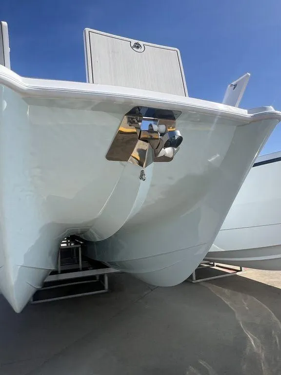 Slide: The Image of 2024 Twin Vee 400 Center Console GFX boat hull on trailer. - 3