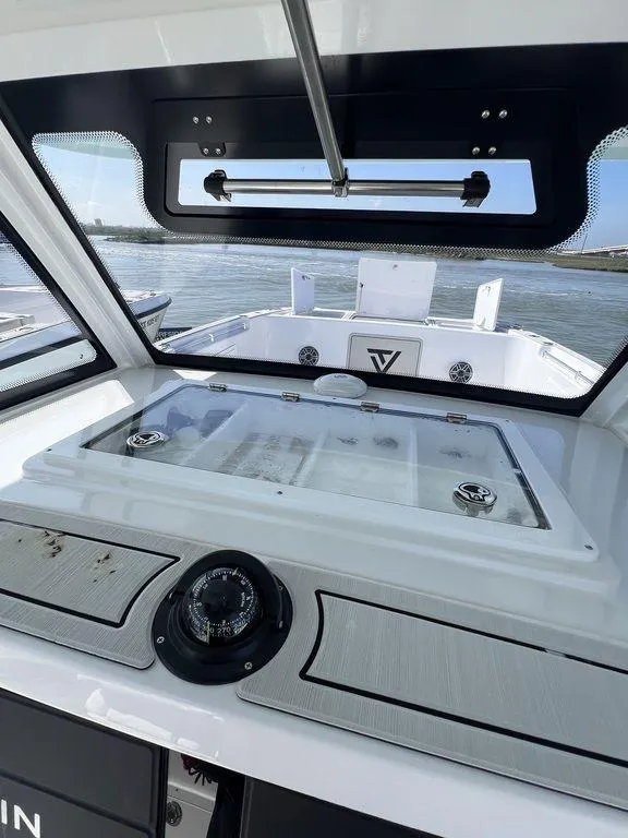 Slide: The Image of 2024 Twin Vee 400 Center Console GFX boat interior with ocean view. - 31