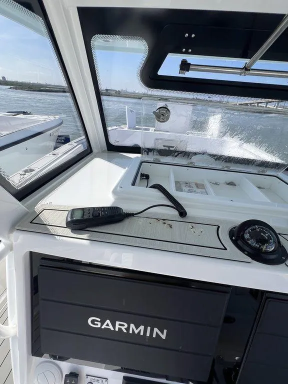 Slide: The Image of 2024 Twin Vee 400 Center Console GFX boat interior with Garmin navigation system. - 33
