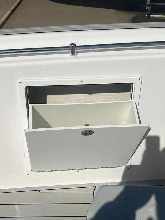 Slide: The Image of 2024 Twin Vee 400 Center Console GFX storage compartment. - 39