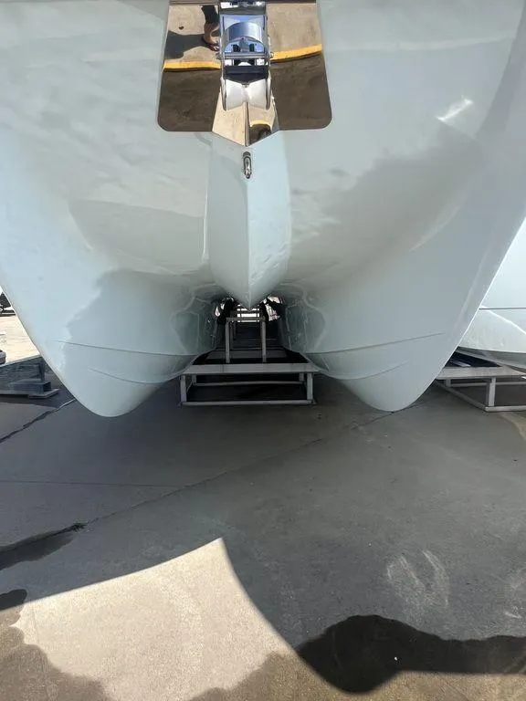Slide: The Image of 2024 Twin Vee 400 Center Console GFX catamaran hull on trailer. - 4