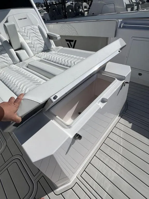 Slide: The Image of 2024 Twin Vee 400 Center Console GFX boat with open storage compartment. - 41