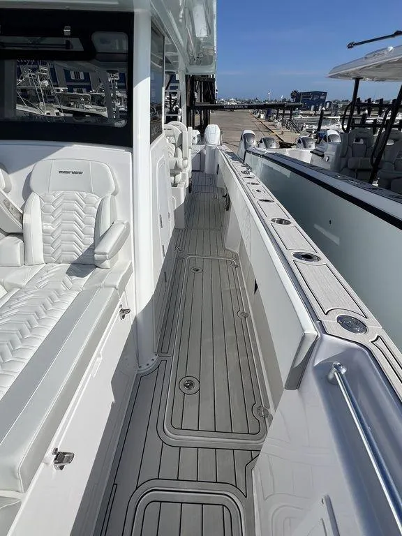 Slide: The Image of 2024 Twin Vee 400 Center Console GFX boat with sleek deck and seating. - 43