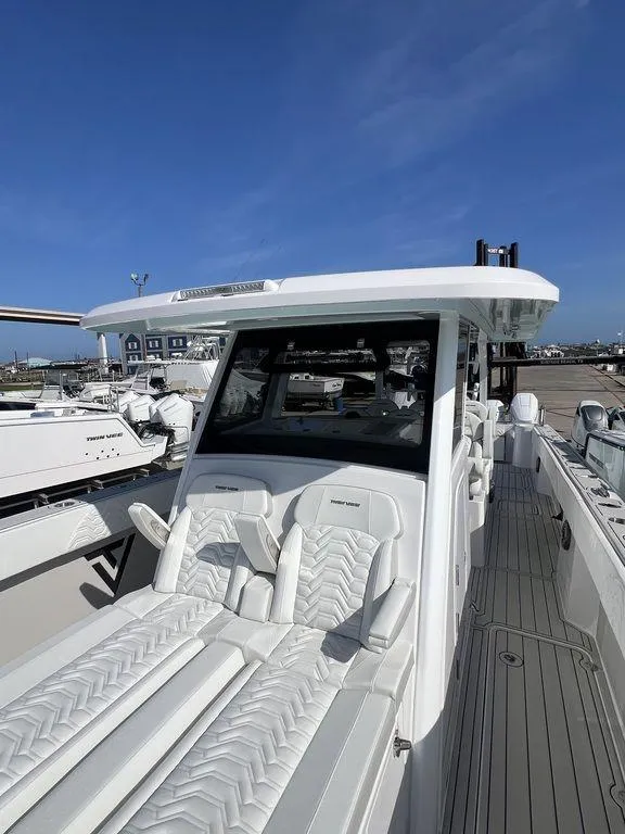 Slide: The Image of 2024 Twin Vee 400 Center Console GFX boat with luxurious seating and sleek design. - 45