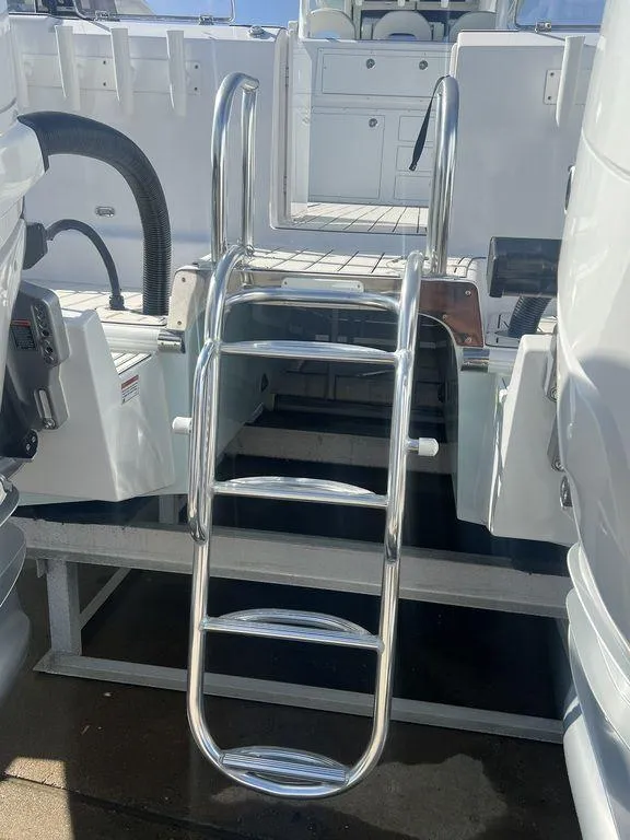 Slide: The Image of 2024 Twin Vee 400 Center Console GFX with stainless steel swim ladder. - 8