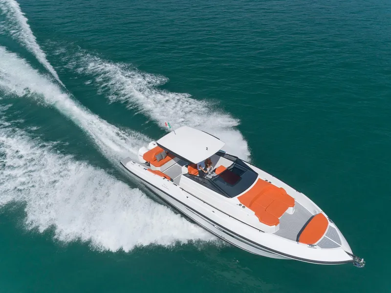 Slide: The Image of 2024 Rio Yachts Daytona 35 cruising on clear blue water, featuring sleek design and vibrant orange accents. - 2