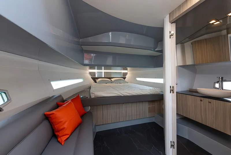 Slide: The Image of 2024 Rio Yachts Daytona 35 interior with modern design, cozy bed, and stylish seating. - 31